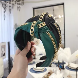 Punk style PU leather knotted headband with gold chain details for women in green and black