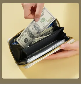 White long zipper wallet interior detail showing multi-card slots and large capacity design.