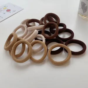 Close-up of seamless toweling hair ties in milk tea earth tones