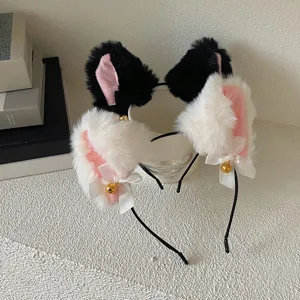 Close-up of plush cat and rabbit ear headbands with bows and bells for cosplay