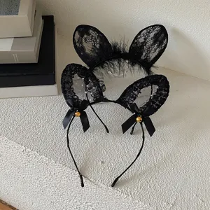 Close-up of black lace cat and rabbit ear headbands for Halloween cosplay on white background.