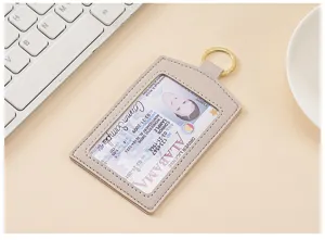 Portacarte in ecopelle grigia con portachiavi e finestra per badge aziendale.