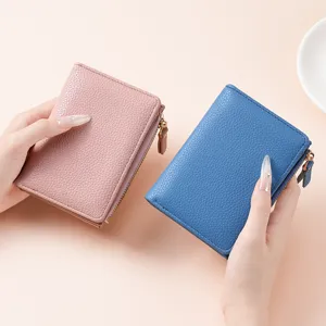Women short PU leather wallet with zipper, multi-card slots, solid litchi pattern design.