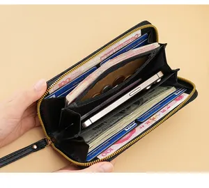 Detailed view of women's long zipper wallet showing multiple card slots and large capacity.