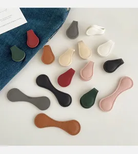 Collection of multi-colored leather magnetic clips for pant leg and sleeve shortening