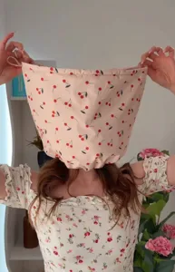 Detailed macro view showing the waterproof cherry print shower cap with large hair capacity