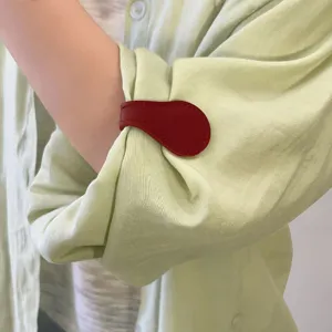 Red leather magnetic cuff clip for holding rolled-up sleeves or pant hems