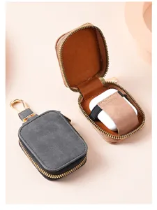 Leather zipper protective case for wireless earphones with keychain hook, durable design.