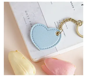 Light blue leather heart keychain with gold metal chain cute bag charm car key ring.