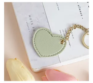 Cute light green leather heart keychain with gold chain and ring for bags and car keys