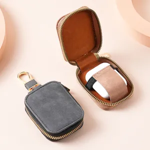 Solid color PU leather zipper bluetooth earphone protective case with portable metal hook.