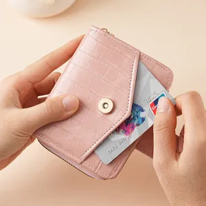 Pink crocodile pattern short women wallet with card slot and snap closure for daily use