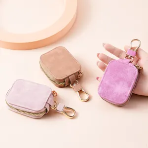 Solid color suede protective case with zipper and keychain for wireless earbuds and small items.