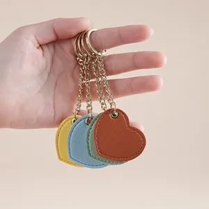Cute heart leather keychain pendant for cute bags and car keys stylish accessory.