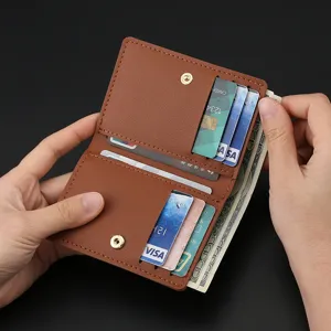 Minimalist folding leather mini wallet card holder with snap button and multiple card slots.