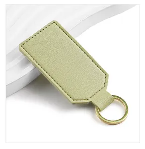Green PU leather keychain with gold metal ring, minimalist style key holder for daily use.