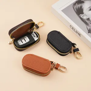 Estuche para llaves minimalista de cuero con cremallera y gancho metálico para el coche.