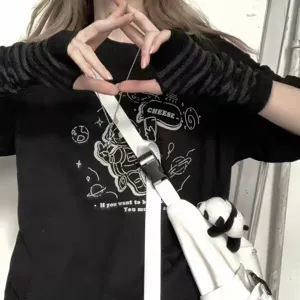 Close-up of Y2K style black striped knit fingerless arm warmers worn by a model