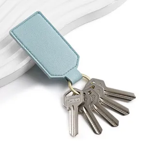 Light blue PU leather keychain with metal ring and keys, minimalist square daily accessory.