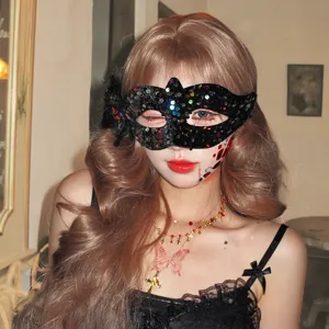 Close-up of a black sequin masquerade mask worn for Halloween party dress-up