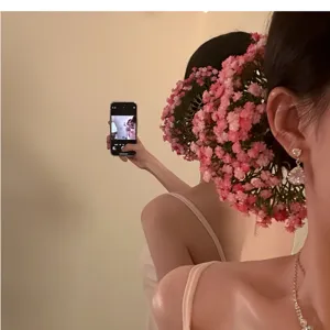 Detailed view of pink baby's breath flower hairpin worn for a bridal look