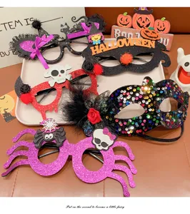 Detailed view of various Halloween party glasses and sequin masks on a white tray