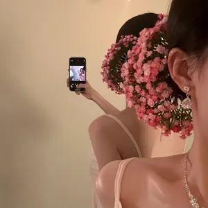 Elegant pink gypsophila flower hair pin for wedding hairstyles and bridal hair styling