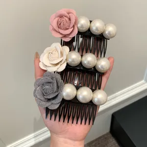 Detail view of elegant floral and pearl hair combs set for women in three colors