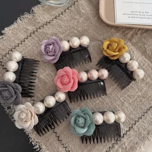 Elegant flower and pearl hair combs set for women, close-up lifestyle product shot