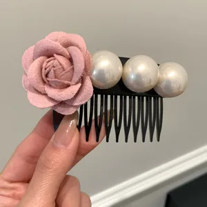 Elegant hair comb accessory with pink fabric rose and three large white pearls.
