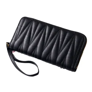 Black quilted long wallet for women with zipper closure and wrist strap elegant clutch purse.