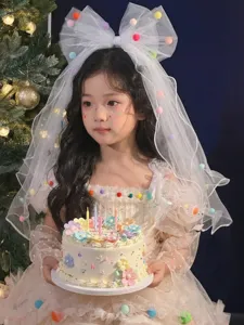 Elegant girl's princess birthday veil with colorful pom-poms and large bow decoration