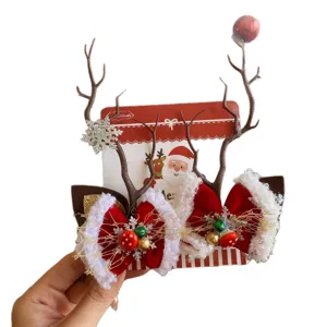 Pinzas para el cabello de reno navideño con lazos rojos y detalles de copos de nieve