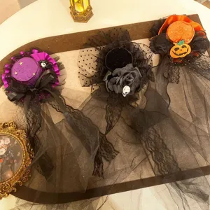 Close-up of Halloween witch veils featuring gothic skull and pumpkin decorations