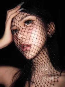 Close-up of sparkling rhinestone fishnet veil for festival photography styling