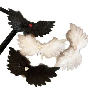 Angel and demon wing feather hair clips with heart rhinestones for Halloween cosplay.