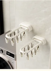 Gedetailleerd overzicht van opvouwbaar wandmontage sokkendroogrek met meerdere clips voor lingerie.