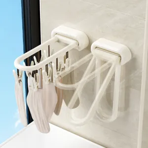 Opvouwbaar wandmontage sokken droogrek met meerdere clips voor balkon ondergoed gebruik.