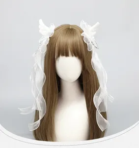 Detail shot of the cute angel wing twin tail side hair clips with white organza ribbons.