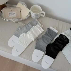 Collection of thin ballet style slouch socks for women in white gray and black colors