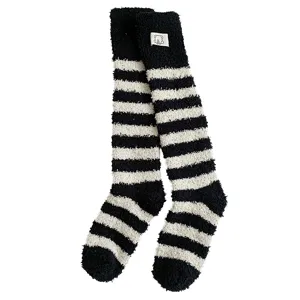 Cozy black and white striped coral fleece socks for warm winter indoor floor wear