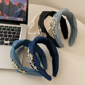 Detailed macro view showing luxury rhinestone embellished denim knotted headbands