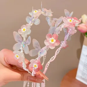 Detailed view of fairy butterfly floral headband with elegant pearl streamers for girls.