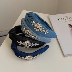 Stack of stylish denim knotted headbands with luxury rhinestone floral embellishments