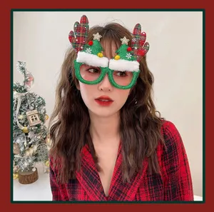 Female model wearing festive Christmas reindeer antler and glittery tree party glasses.