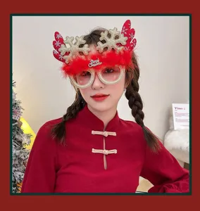 Close-up of model wearing cute Christmas reindeer antler glasses with glitter snowflakes
