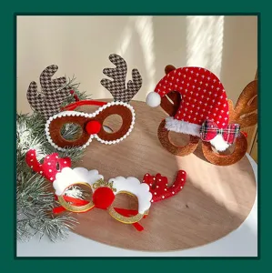 Detailed shot of three styles of Christmas reindeer and Santa hat party eyewear props