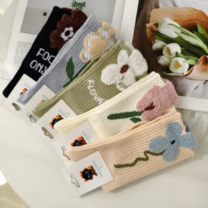 Detailed view of vintage floral jacquard ribbed crew socks in multiple soft colors.