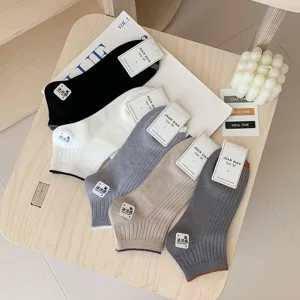 Detail shot of five colors of men's minimalist low-cut comfortable cotton boat socks