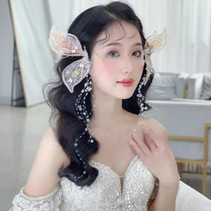 Barrettes à cheveux élégantes en ailes de papillon en cristal avec de longs glands